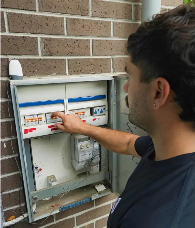 Electrician completing an electrical safety check